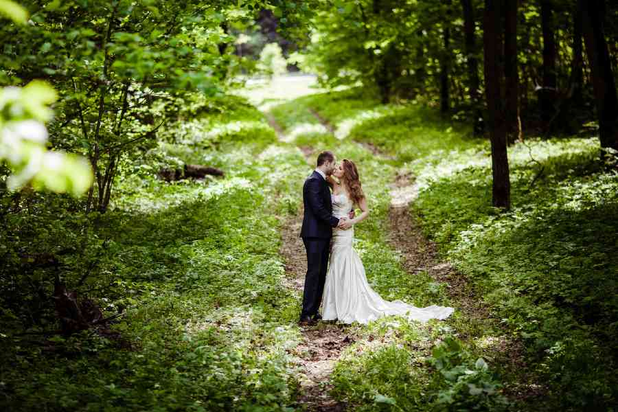 Wedding Couple Embracing in the Forest